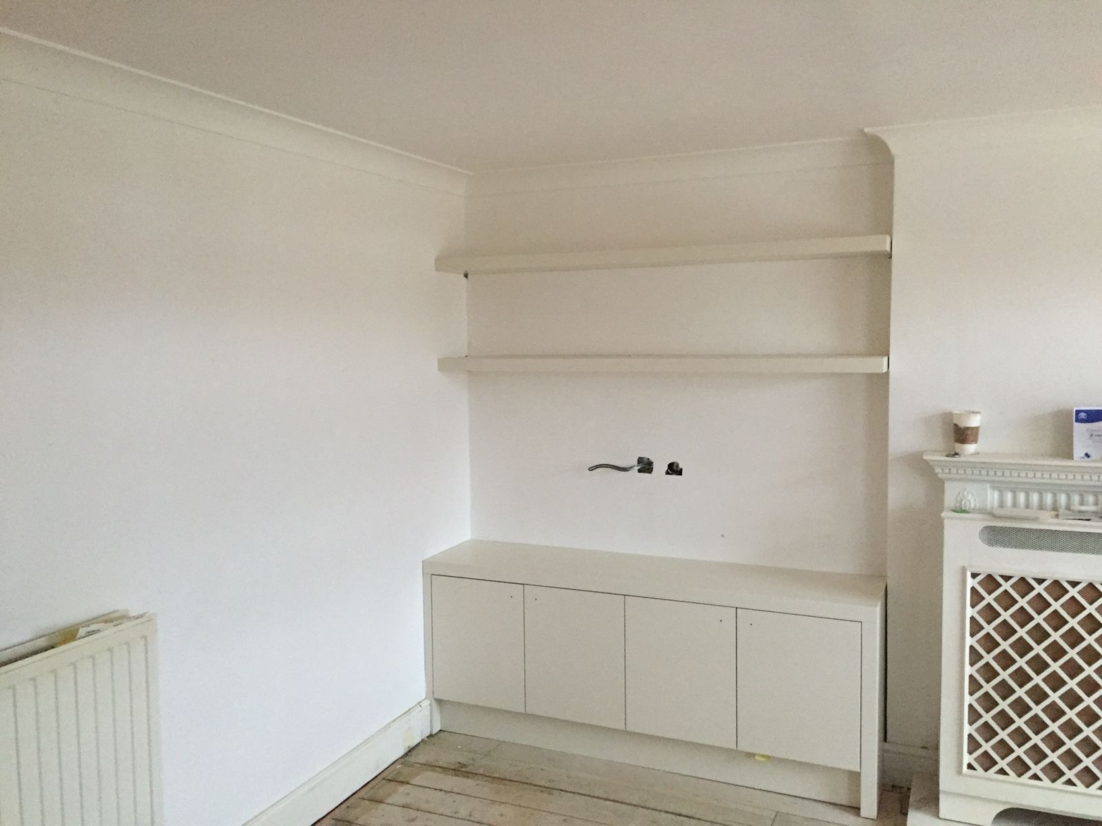 Alcove cupboard with floating shelves