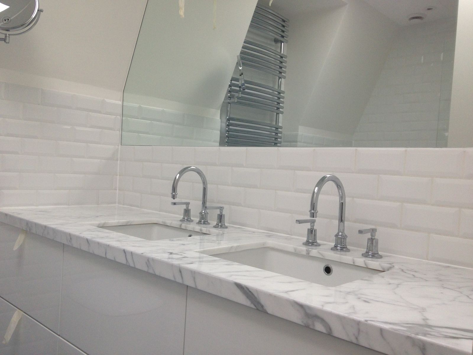 Marble double vanity with metro tiles and mirror