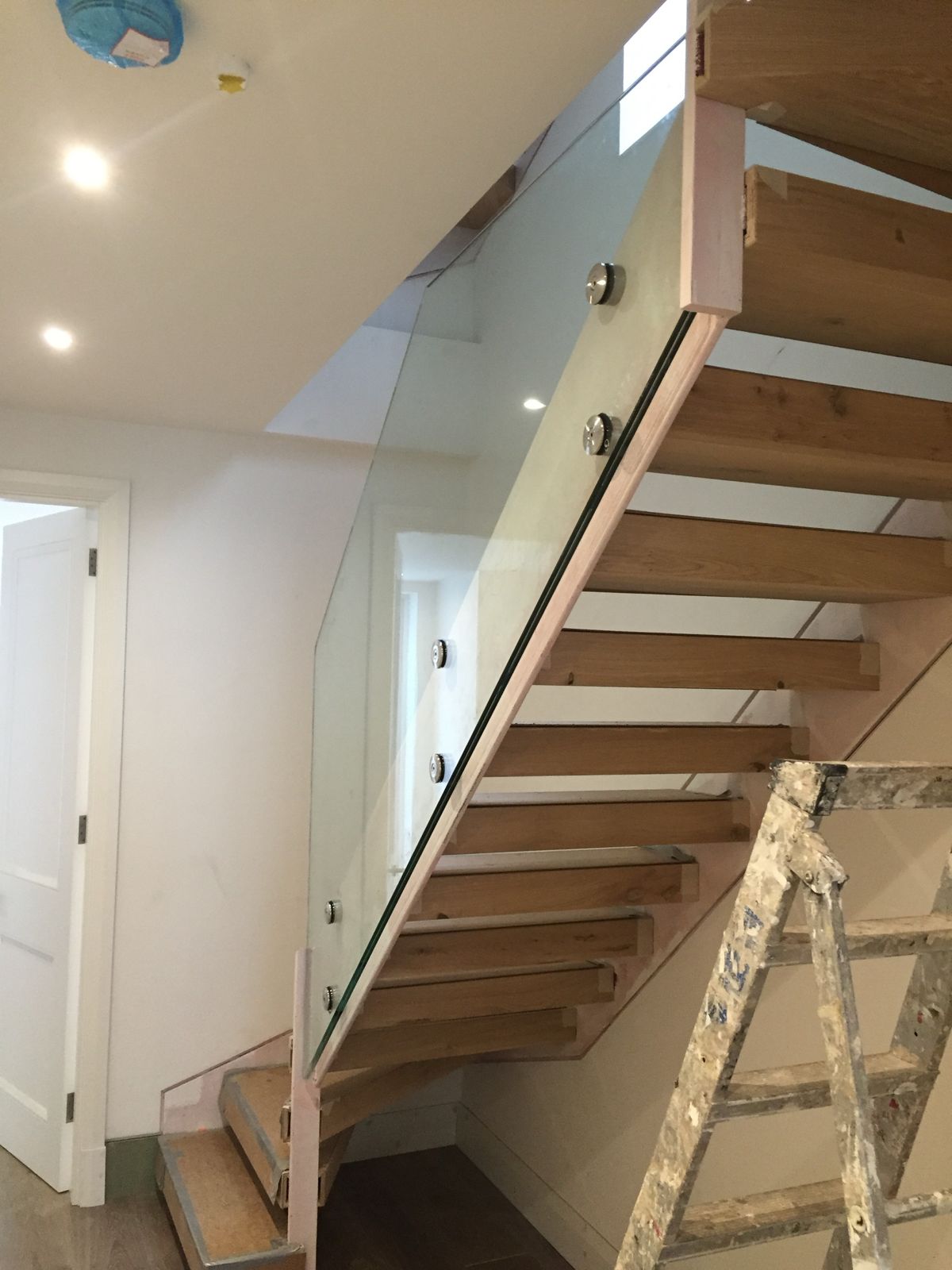 Oak staircase with frameless glass balustrade