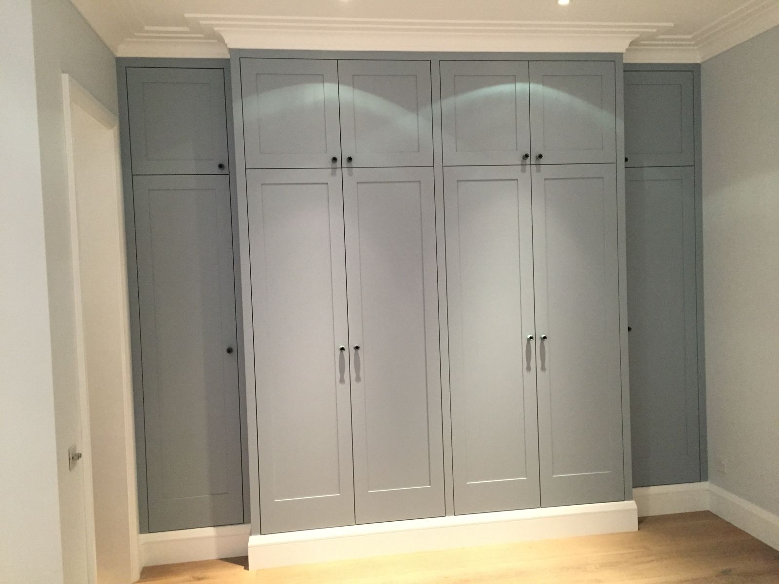 Blue-grey shaker fitted wardrobes with cornice